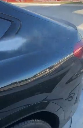 Close-up of a mirror-gloss paint finish after an exterior detail
